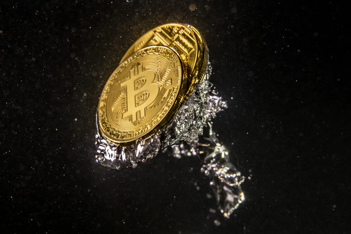 In this photo illustration a visual representation of the digital currency Bitcoin sinks into water in London, England on Aug. 15, 2018. (Dan Kitwood/Getty Images)