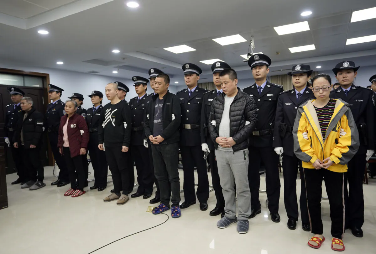 A trial continues as fentanyl drug traffickers are sentenced in court in Xingtai, north China's Hebei Province on Nov. 7, 2019. (Jin Liangkuai/Xinhua via AP)