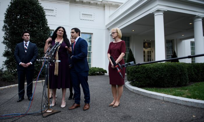 People speak to the press after visiting President Donald Trump in the Oval Office of the White House in recognition of the National Day for the Victims of Communism on Nov. 7, 2019. (Brendan Smialowski/AFP via Getty Images)