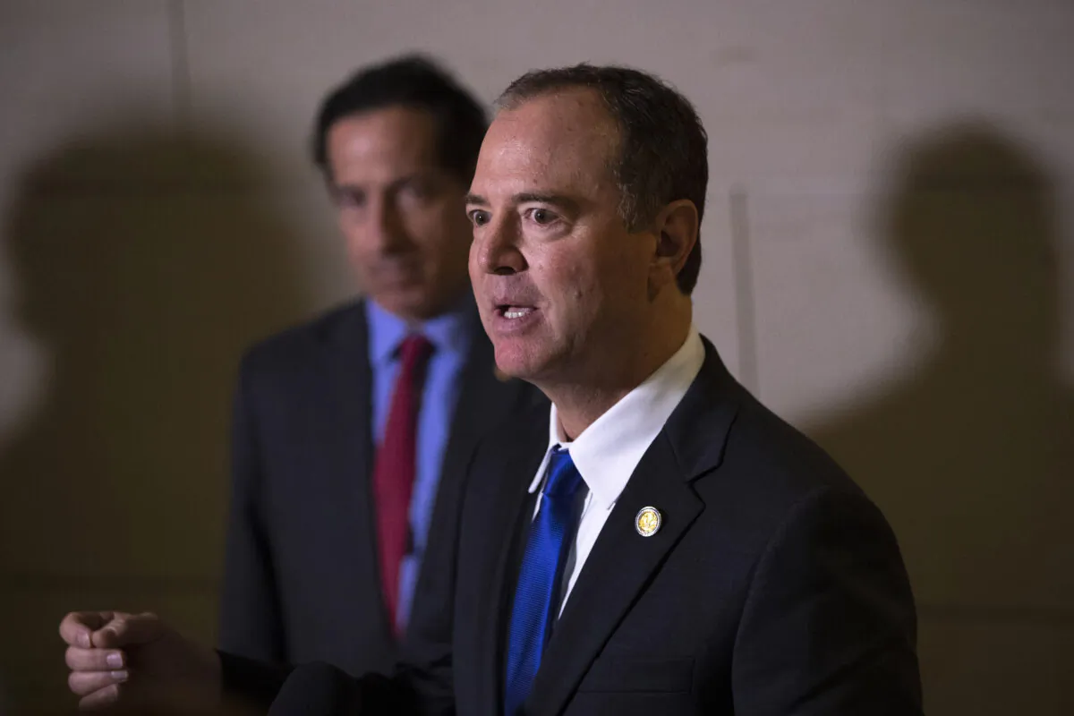 (L-R) Rep. Jamie Raskin (D-Md.) stands next to House Intelligence Committee Chairman Rep. Adam Schiff (D-Calif.) as he speaks to reporters following a closed-door hearing with the House Intelligence, Foreign Affairs and Oversight committees at the U.S. Capitol in Washington on Nov. 4, 2019. (Drew Angerer/Getty Images)