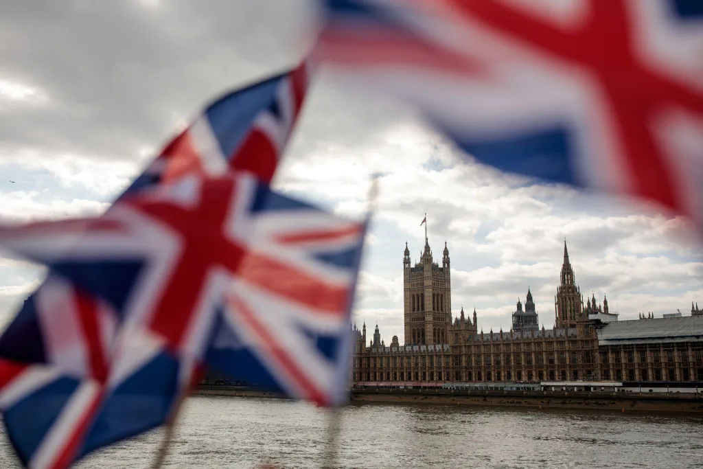 Union Jack flags flutter in the wind in front of the Houses of Parliament in London on March 26, 2019. (Jack Taylor/Getty Images)