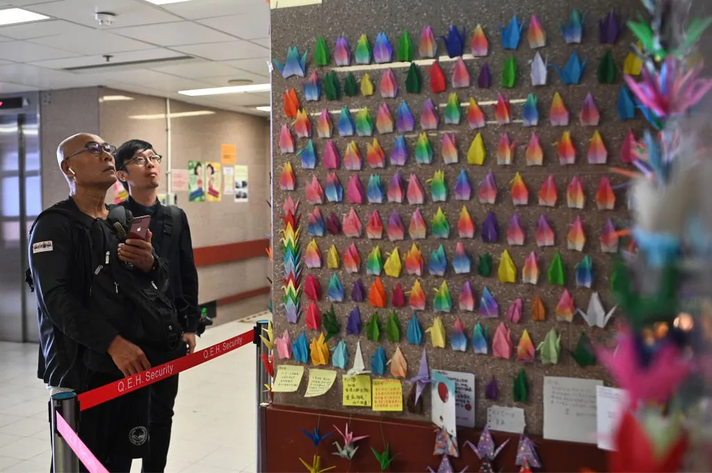 Paper cranes are placed on a wall outside the intensive care unit of Queen Elizabeth Hospital in Hong Kong on Nov. 8, 2019. (Philip Fong/AFP via Getty Images)