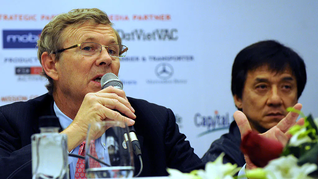 William Magee (L), co-founder of Operation Smile Foundation speaks next to Jackie Chan, ambassador for Operation Smile, during a press conference marking the 20th anniversary of Operation Smile Vietnam, in Hanoi on Nov. 4, 2009. (Hoang Dinh Nam/AFP via Getty Images)