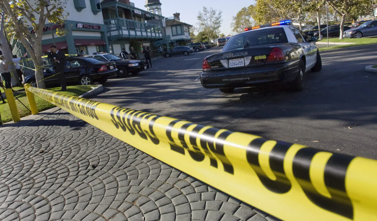 Crime scene tape at a mini mall where a deadly shooting occurred at Salon Meritage in Seal Beach, California, on Oct. 12, 2011. AFP PHOTO / JONATHAN ALCORN (Photo credit should read JONATHAN ALCORN/AFP via Getty Images)