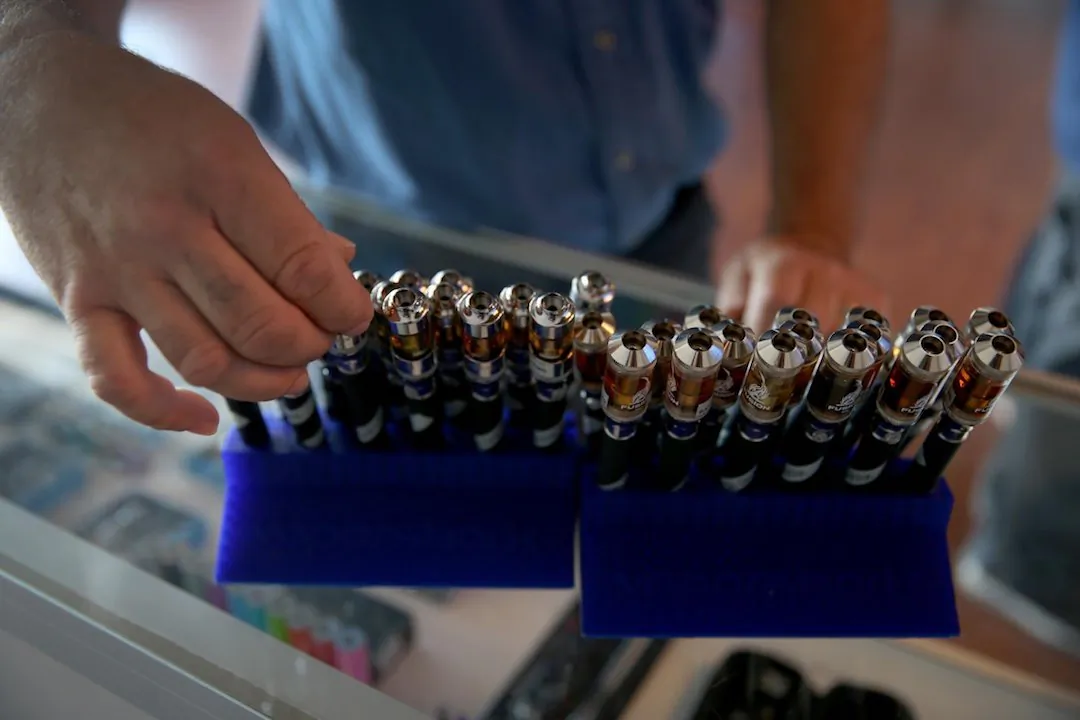 A customer picks from different flavors of electronic cigarette vapor. (Joe Raedle/Getty Images)