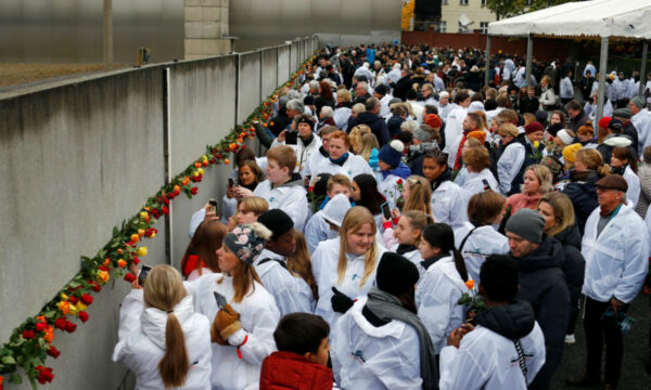 People place roses into a gap