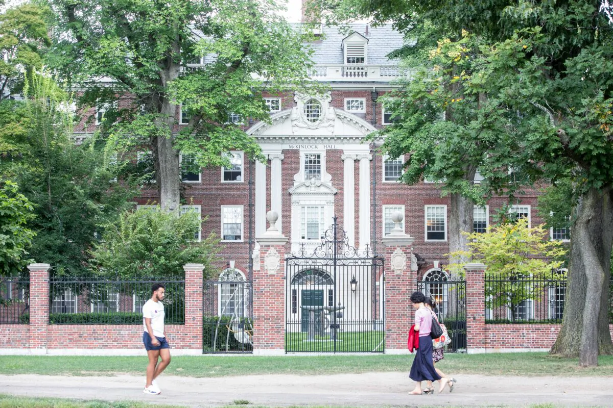Pedestrians walk past a Harvard University building in Cambridge, Mass., on Aug. 30, 2018. (Scott Eisen/Getty Images)