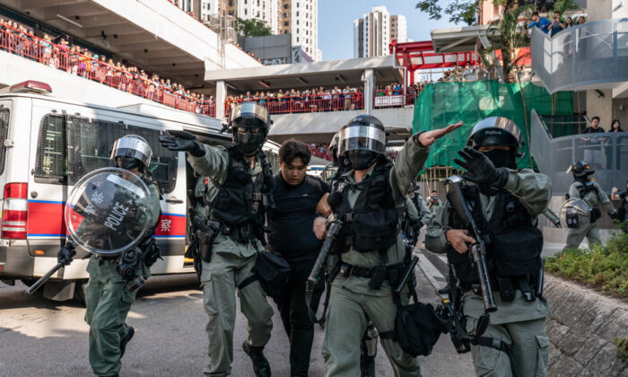 A protester is detained by riot police during a demonstration in Hong Kong on Nov. 10, 2019. (Anthony Kwan/Getty Images)