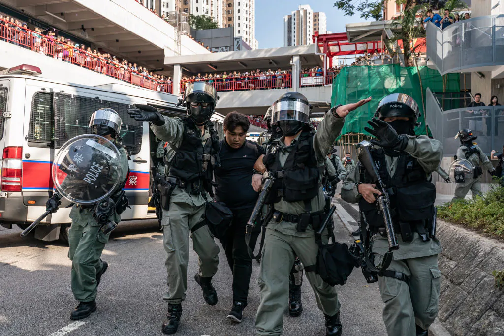 A protester is detained by riot police during a demonstration in Hong Kong on Nov. 10, 2019. (Anthony Kwan/Getty Images)