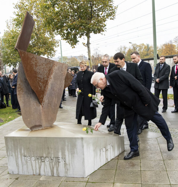 German president Frank-Walter Steinmeier, in front, Hungary's President Janos Ader , Czech Republic's president Milos Zeman, Slovakia's president Zuzana Caputova and Poland's president Andrzej Duda lay down roses at the Visegard Four monument in Berlin at a ceremony marking the 30th anniversary of the fall of the the Wall in Berlin, Germany, Nov. 9, 2019. (Bernd von Jutrczenka/dpa via AP)