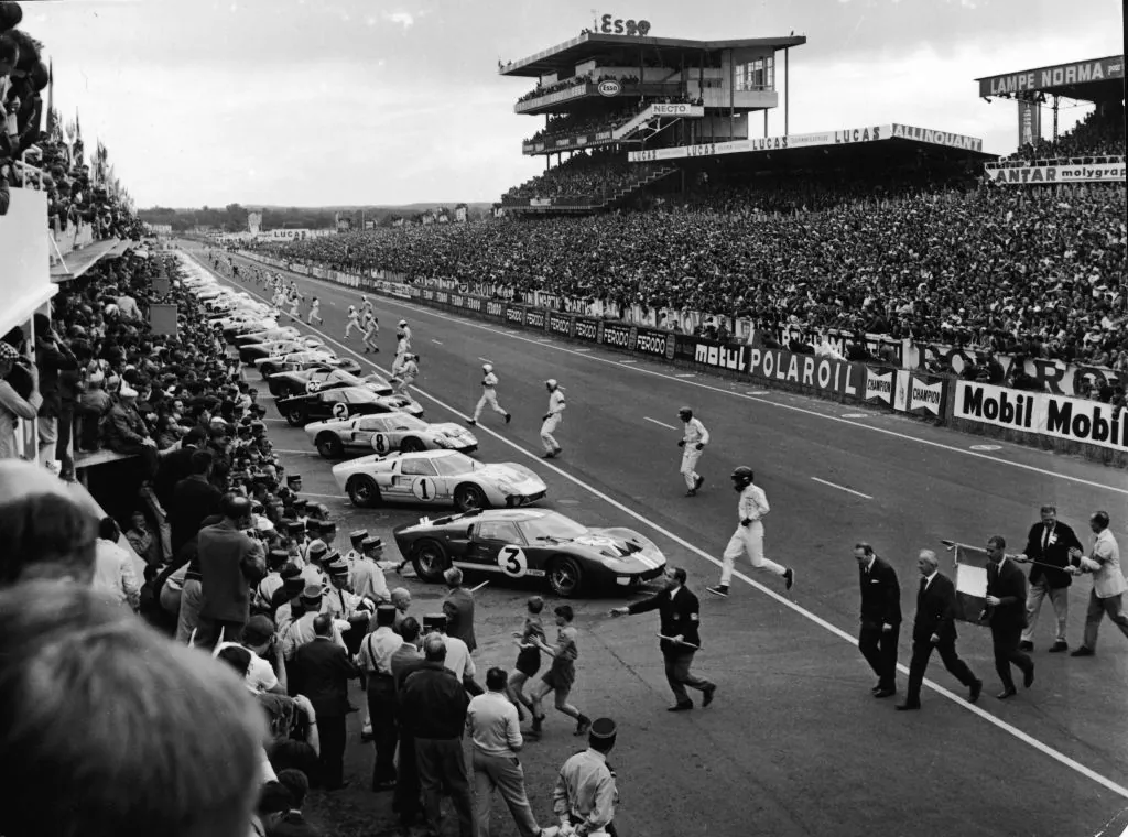 Drivers run to their cars at the 24 Hours Le Mans Auto race, France, on June 18, 1966. (Agence France Presse/Getty Images)