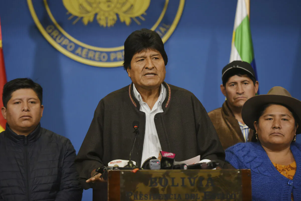 In this photo provided by the Agencia Boliviana de Informacion, Bolivian President Evo Morales speaks from the presidential hangar in El Alto, Bolivia, Nov. 10, 2019. (Enzo De Luca/Agencia Boliviana de Informacion via AP)