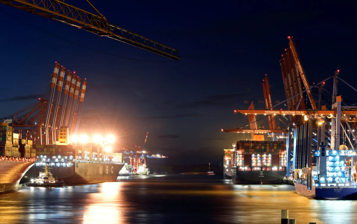 Container ships are loaded at a loading terminal in the port of Hamburg in Germany on Oct. 28, 2019. (Fabian Bimmer/Reuters)