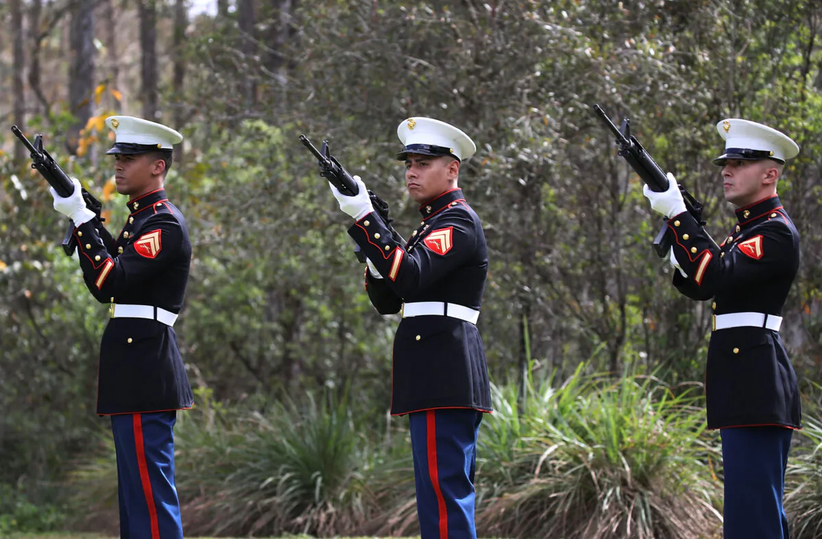 Marines fire a 21-gun salute in a file photograph. (Joe Raedle/Getty Images)