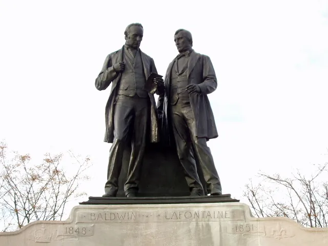 Statue of Robert Baldwin and Louis-Hippolyte LaFontaine on Parliament Hill in Ottawa. In the mid-1800s, the two politicians overcame adversity and worked together to bring responsible government to the Province of Canada. (Public Domain)