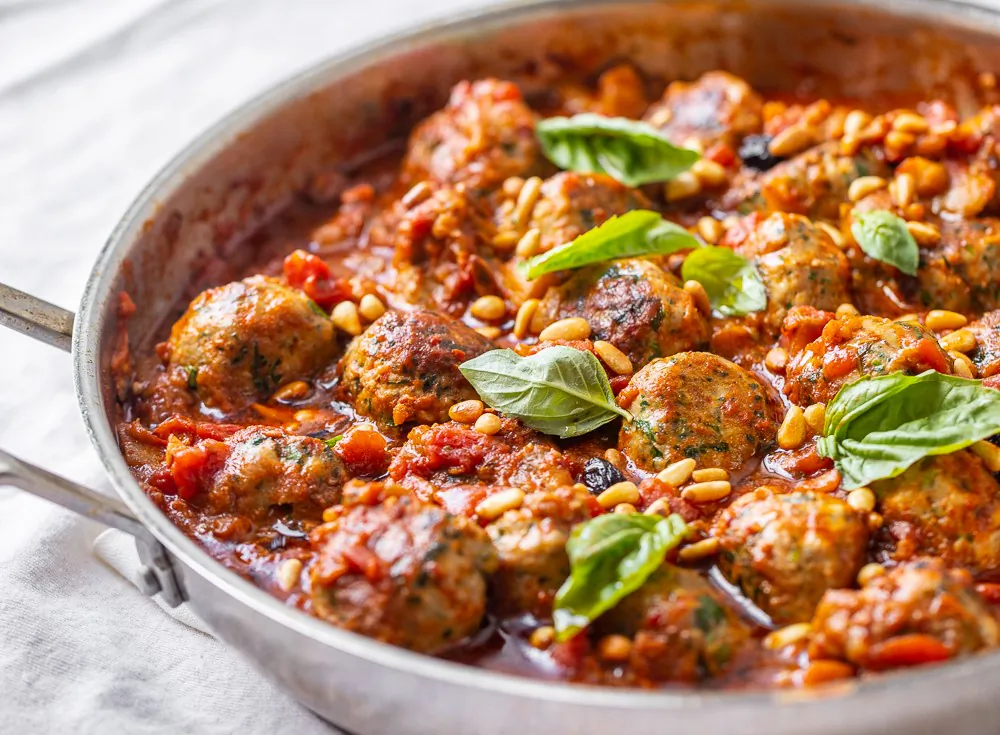 Tuna meatballs in a tomato, eggplant, and harissa sauce. (Maria Midoes for New York Shuk)