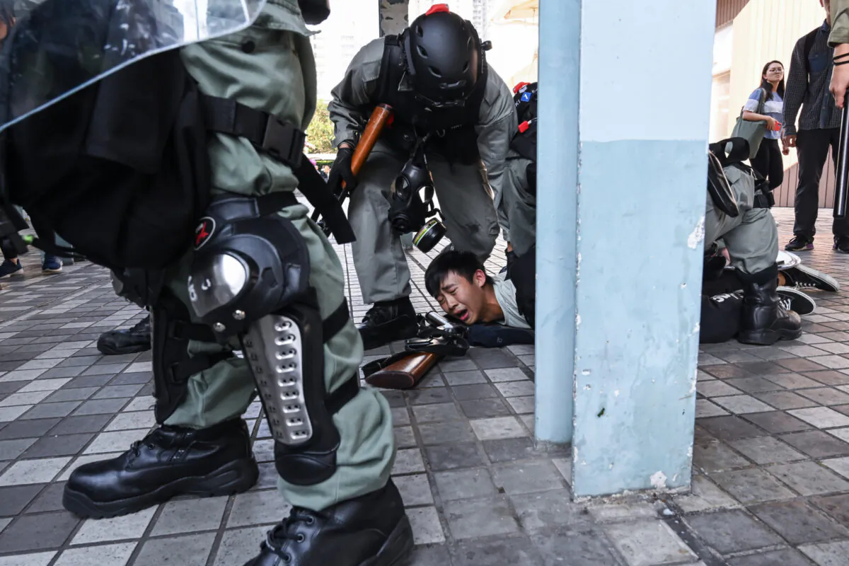 A protestor arrested by riot police in Wong Tai Sin district in Hong Kong, on Nov. 11, 2019. (Billy H.C. Kwok/Getty Images)