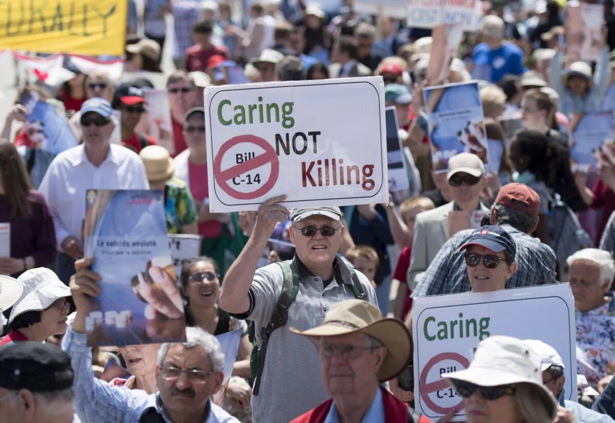 People rally against medically assisted dying legislation on Parliament Hill in Ottawa on June 1, 2016. (The Canadian Press/Justin Tang)