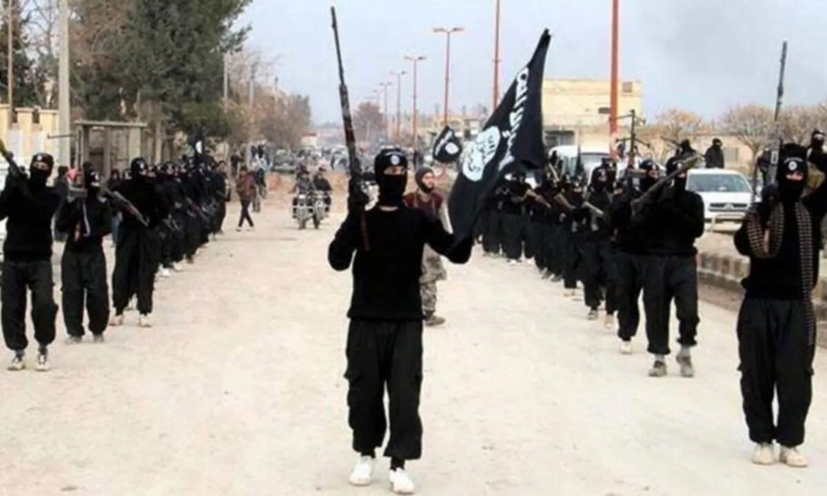 ISIS terrorists parade down a street in Raqqa, Syria, on Jan. 14, 2014. (ISIS Website via AP)