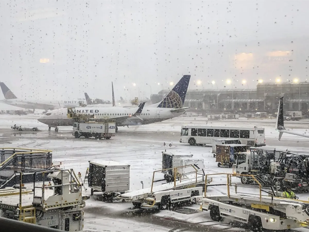 Snow falls on the United Terminal at O'Hare Airport in Chicago on the morning of Nov. 11, 2019. (Daryl Van Schouwen/Chicago Sun-Times via AP)