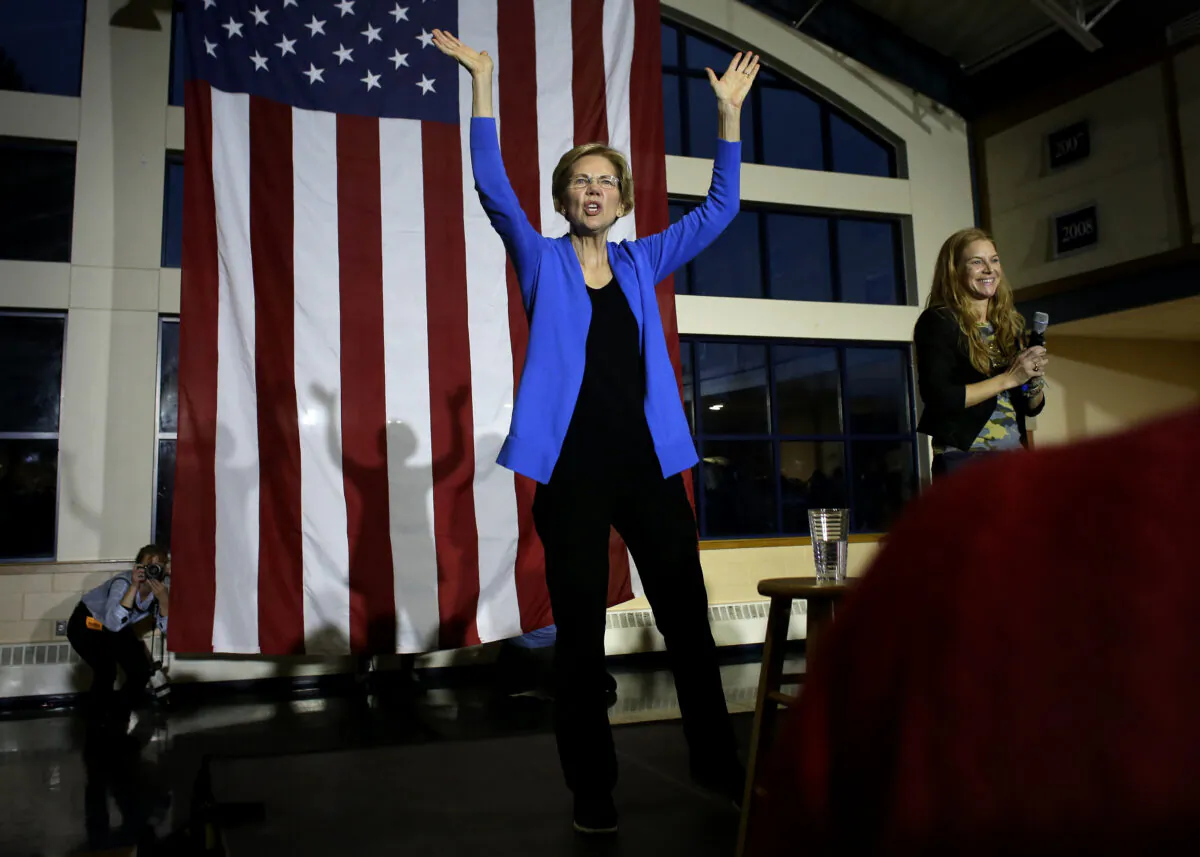 Democratic presidential candidate Sen. Elizabeth Warren (D-Mass.) center, addresses an audience during a campaign event in Exeter, N.H. on Nov. 11, 2019. (Steven Senne/AP Photo)