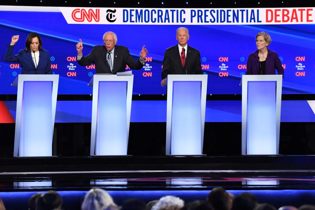 Democratic presidential hopefuls (from L) California Senator Kamala Harris, Vermont Senator Bernie Sanders, former Vice President Joe Biden and Massachusetts Senator Elizabeth Warren take part in the fourth Democratic primary debate of the 2020 presidential campaign season co-hosted by The New York Times and CNN at Otterbein University in Westerville, Ohio on Oct. 15, 2019. (SAUL LOEB/AFP via Getty Images)