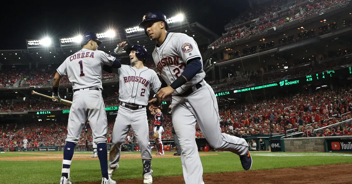Houston Astros celebrate after hitting a grand slam home run against the Washington Nationals during the seventh inning in Game Four of the 2019 World Series at Nationals Park in Washington, DC on Oct. 26, 2019. (Patrick Smith/Getty Images)