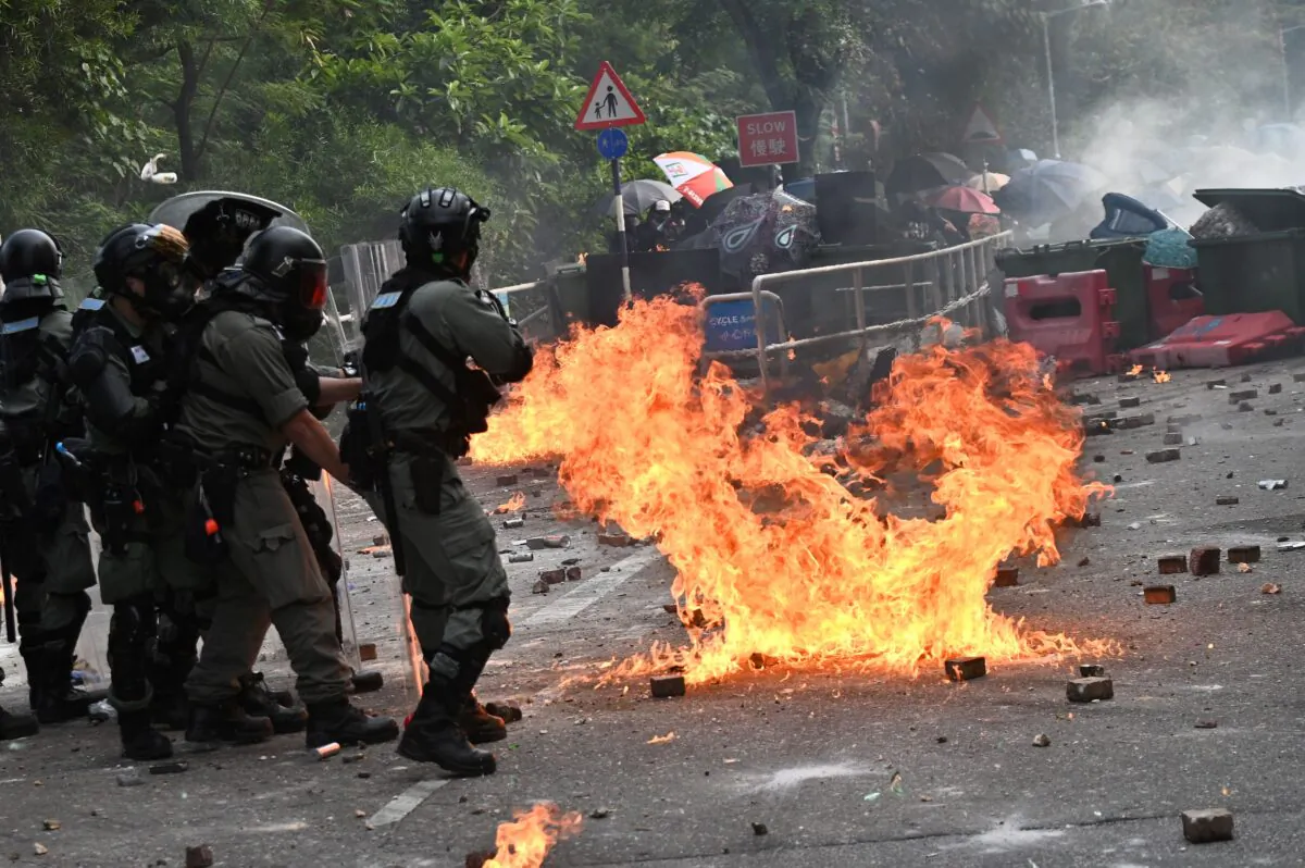 Police fire tear gas toward protesters at the Chinese University of Hong
Kong, in Hong Kong on Nov. 12, 2019. Protesters struck the city's transport network for a second day running after police shot a young
demonstrator and another man was set on fire. (PHILIP FONG/AFP via Getty
Images)