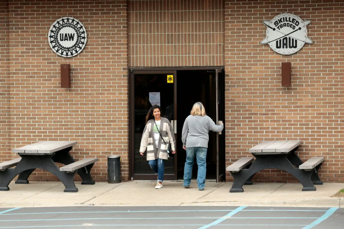United Auto Workers (UAW) members walk outside of UAW Local 5960 as they vote in Lake Orion, Michigan, as they strike against General Motors on October 25, 2019. (Jeff Kowalsky/AFP via Getty Images)