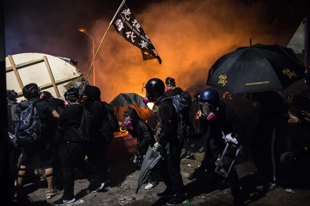 Protesters gather during clashes with police at the Chinese University of Hong Kong (CUHK), in Hong Kong on Nov. 12, 2019. (Dale De La Rey/AFP via Getty Images)