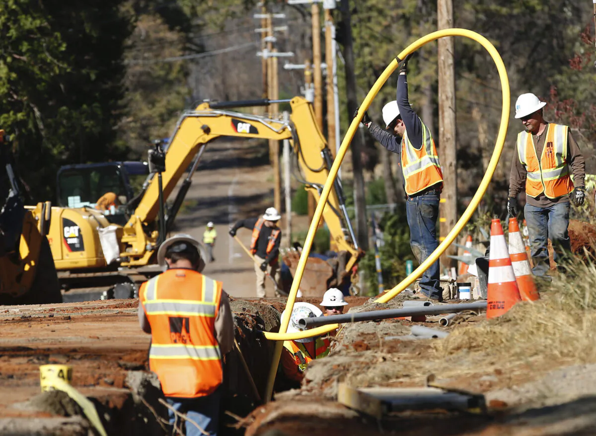 Pacific Gas and Electric Company workmen bury utility lines in Paradise, Calif., on Oct. 31, 2019. (Rich Pedroncelli/AP Photo)