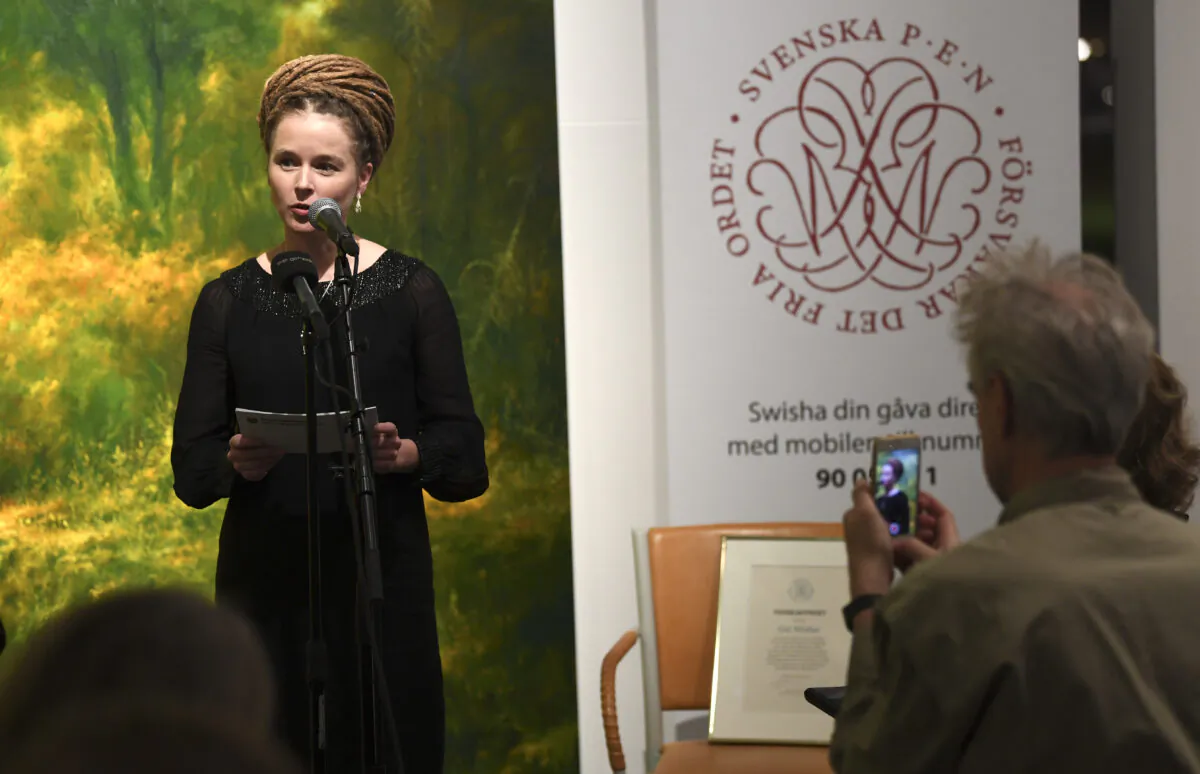 Swedish Culture and Democracy Minister Amanda Lind presents the Swedish PEN's Tucholsky Prize given to Chinese-Swedish book publisher Gui Minhai in Stockholm, Sweden on Nov. 15, 2019. China on Friday threatened "counter-measures" against Sweden if the culture minister awards a Swedish PEN rights prize as planned to detained Chinese-Swedish book publisher Gui Minhai. (Fredrik Sandberg/TT News Agency/AFP via Getty Images)