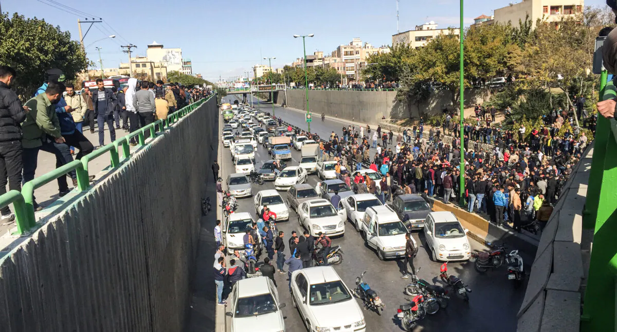 Iranian protesters block a road during a demonstration against an increase in gasoline prices in the central city of Isfahan, on Nov. 16, 2019. (-/AFP via Getty Images)
