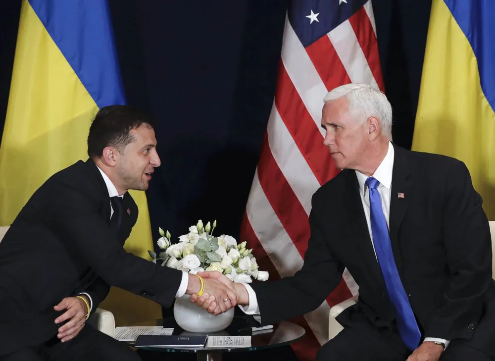 Vice President Mike Pence shakes hands with Ukrainian President Volodymyr Zelensky at a meeting in Warsaw, Poland, on Sept. 1, 2019. (AP)
