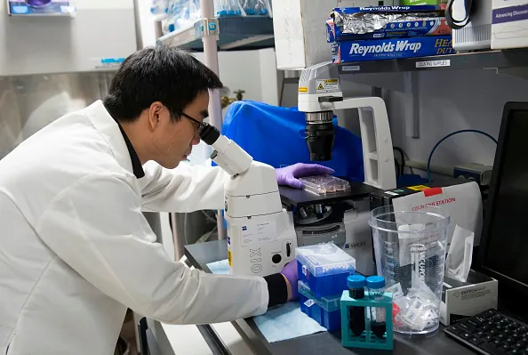 A biologist works on immunotherapy in a lab in Bethesda, Md., on Feb. 7, 2018.   SAUL LOEB/AFP via Getty Images