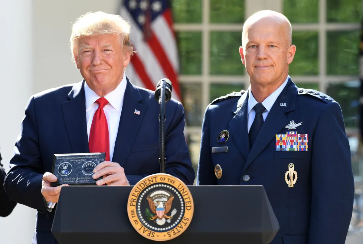General John W. Raymond (R) and President Donald Trump pose during an event establishing the US Space Command in the Rose Garden of the White House in Washington, on Aug. 29, 2019. (Saul Loeb/AFP via Getty Images)