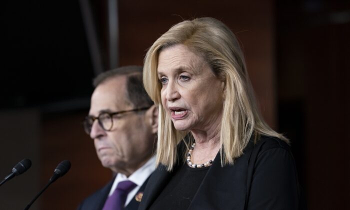 Rep. Carolyn Maloney (D-N.Y.), right, and Rep. Jerrold Nadler (D-N.Y.) speak with reporters in Washington in October 2019, three years before redistricting pitted the two representatives with more than 60 years combined Congressional experience against each other in New York’s Aug. 23 primaries. (J. Scott Applewhite/AP Photo)