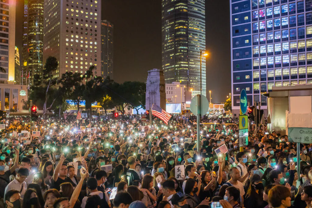 Demonstrators wave U.S. national flags during a rally in support of the Hong Kong Human Rights and Democracy Act in Hong Kong on Oct. 14, 2019. (Billy H.C. Kwok/Getty Images)