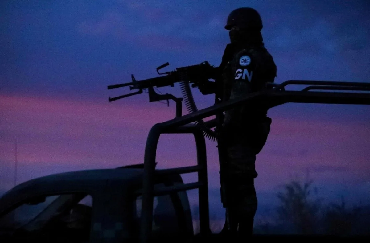 Members of the National Guard guard a caravan of members of US Mormon family Lebaron as they arrive in a convoy from the US to the municipality of Bavispe, in the Sonora mountain range, Mexico, on November 6, 2019. - Mexico alleged on November 6 that a drug cartel called "La Linea" massacred nine Mormon women and children in a case of mistaken identity, but devastated relatives insisted their loved ones were deliberately targeted. (Photo by Herika Martinez / AFP) (Photo by HERIKA MARTINEZ/AFP via Getty Images)