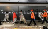 Protesters Stay Holed Up in Hong Kong Campus, Surrounded by Riot Police
