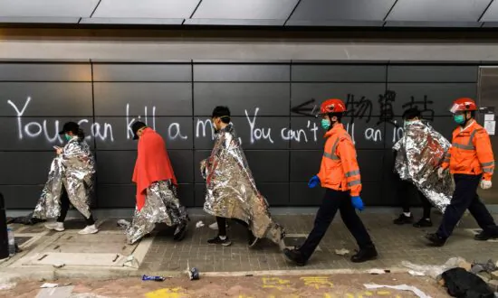 Protesters Stay Holed Up in Hong Kong Campus, Surrounded by Riot Police