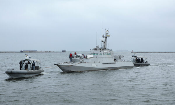 Ukrainian servicemen tug the vessel Nikopol, one of three Ukraine's naval ships captured in the Kerch Strait in November 2018 and then returned by Russia, in the port of Ochakiv, Ukraine November 20, 2019. (Oleg Novikov/Reuters)