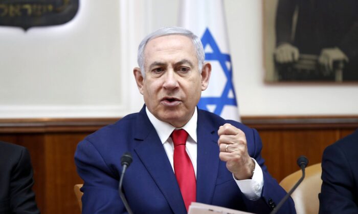 Israeli Prime Minister Benjamin Netanyahu chairs the weekly cabinet meeting in Jerusalem, on April 14, 2019. (Ronen Zvulun/Pool via AP)