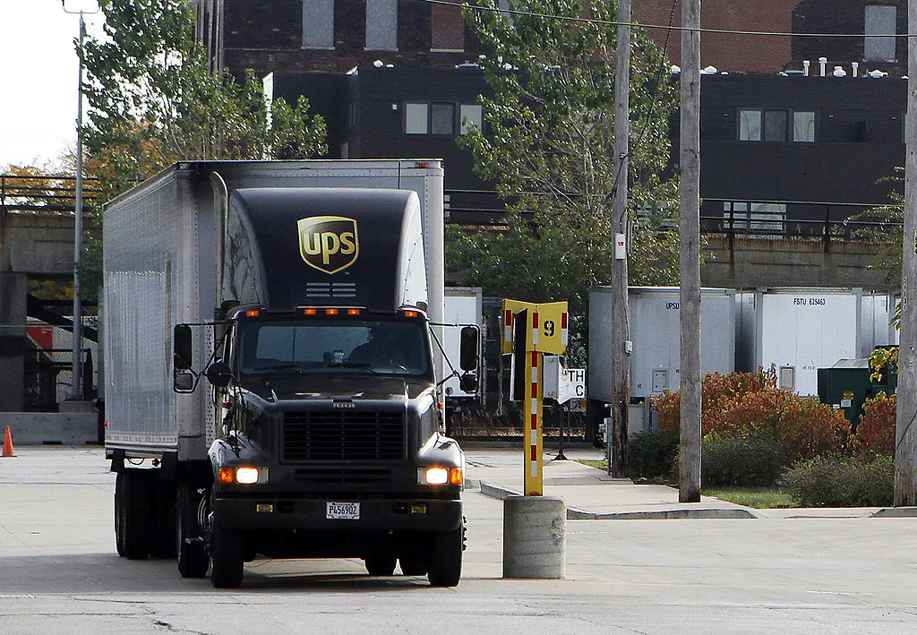 A United Parcel Service (UPS) truck leaves the yard in Chicago, Illinois, on Oct. 29, 2010. (Frank Polich/Getty Images)