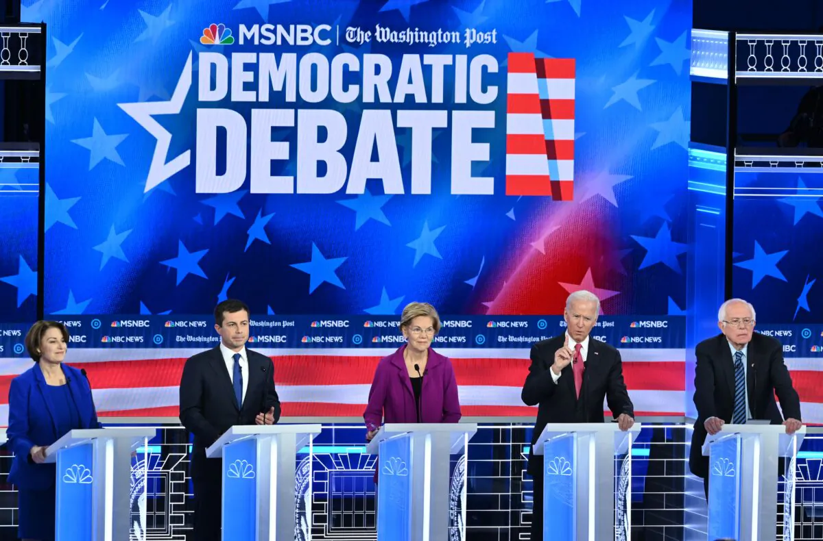 (L-R) Democratic presidential hopefuls Sen. Amy Klobuchar (D-Minn.), South Bend, Indiana Mayor Pete Buttigieg, Sen. Elizabeth Warren (D-Mass.), former Vice President Joe Biden, and Sen. Bernie Sanders (I-Vt.) participate in the fifth Democratic primary debate of the 2020 presidential campaign season on Nov. 20, 2019. (Saul Loeb/AFP via Getty Images)