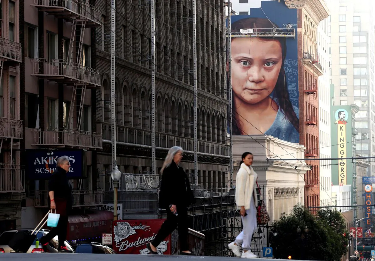 A new four-story-high mural of 16-year-old Swedish climate activist Greta Thunberg is nearing completion on the side of a building near Union Square in San Francisco on Nov. 11, 2019. (Justin Sullivan/Getty Images)