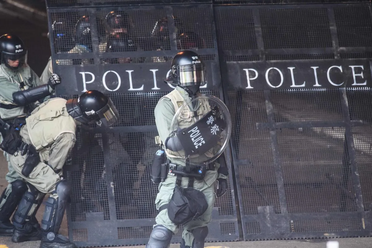 Police set up barricades to stop protesters from escaping from the Hong Kong Polytechnic University in the Hung Hom district of Hong Kong on Nov. 18, 2019.(Anthony Wallace/AFP via Getty Images)