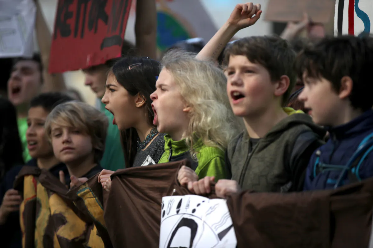 Students carry signs as they march during the Youth Climate Strike in San Francisco, Calif., on March 15, 2019. (Justin Sullivan/Getty Images)