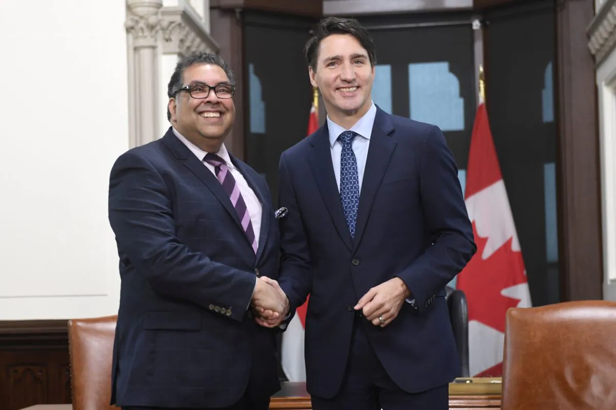 Prime Minister Justin Trudeau and Calgary Mayor Naheed Nenshi shake hands before a meeting in Trudeau’s office on Parliament Hill in Ottawa on Nov. 21, 2019. (The Canadian Press/Adrian Wyld)