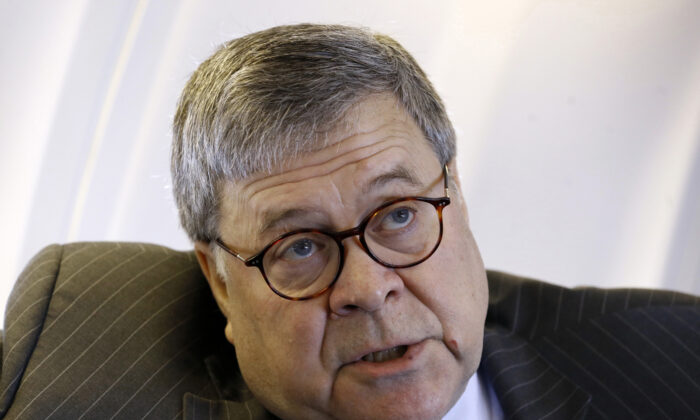 Attorney General William Barr speaks with an Associated Press reporter onboard an aircraft en route to Cleveland, on Nov. 21, 2019. (Patrick Semansky/AP Photo)